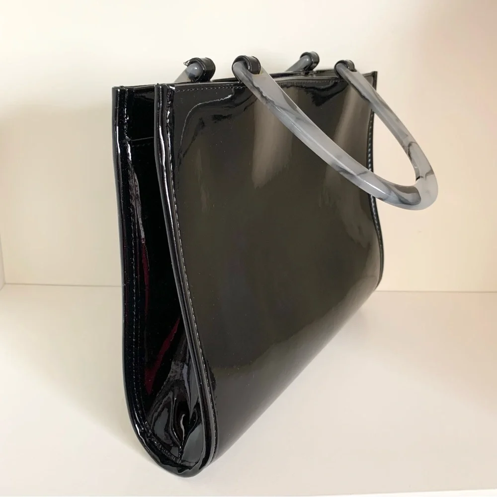Hold NWOT Neiman Marcus black patent marble handle modern bag